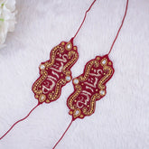 Decorative red and gold jewelry on a white fabric background