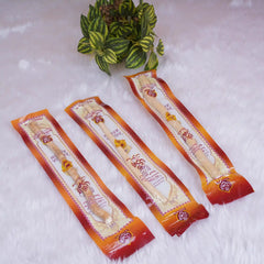 Three individually packed Miswak toothbrushes in orange-red wrappers, perfect for Hajj & Umrah gifts and daily oral hygiene.