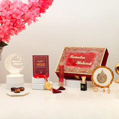 Ramadan Gift Box by Mubarak Moments includes prayer essentials, tasbeeh, ittar, and Islamic decor in a luxurious red velvet box.