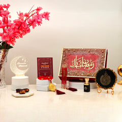 Red Mubarak Moments Ramadan Gift Box with ittar, tasbeeh, Islamic book, and LED decor. Perfect for Ramadan gifting and spiritual reflection.