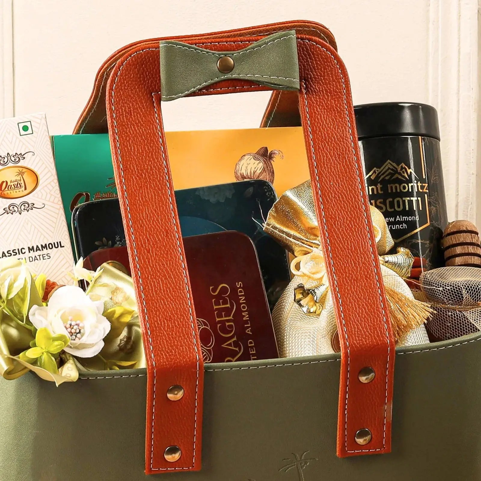 Gift basket with coffee, chocolate, and other items on a white background