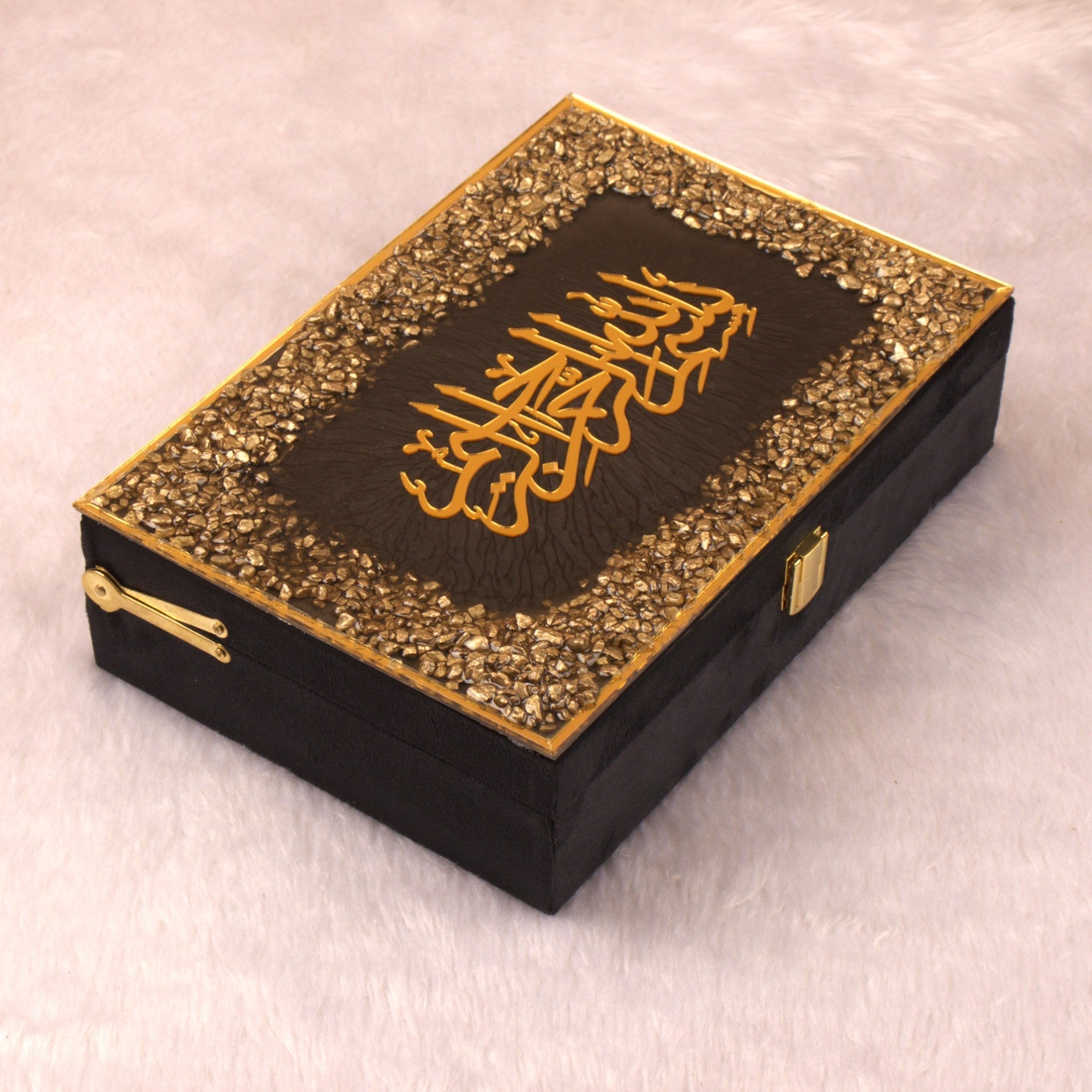 Decorative box with gold embellishments and Arabic calligraphy