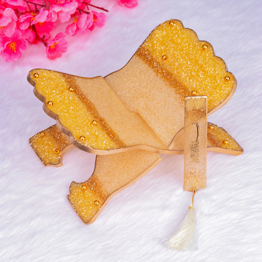 Handcrafted Quran stand and bookmark from The Bling Collection in offwhite and gold resin with glitter accents, ideal for religious gifting.