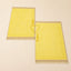 Yellow Janamaz set with personalized names, part of the Bridal Gift Hamper - Sawab-e-Jariya for wedding and religious gifting.