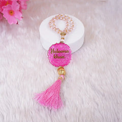 Buy Pink Kids Glitter Collection Ibadah Gift Set for Kids Online featuring a personalized pink tasbeeh with name 'Haleema Khan' and pink tassel. Ideal for Ramadan & EID gifts for kids.