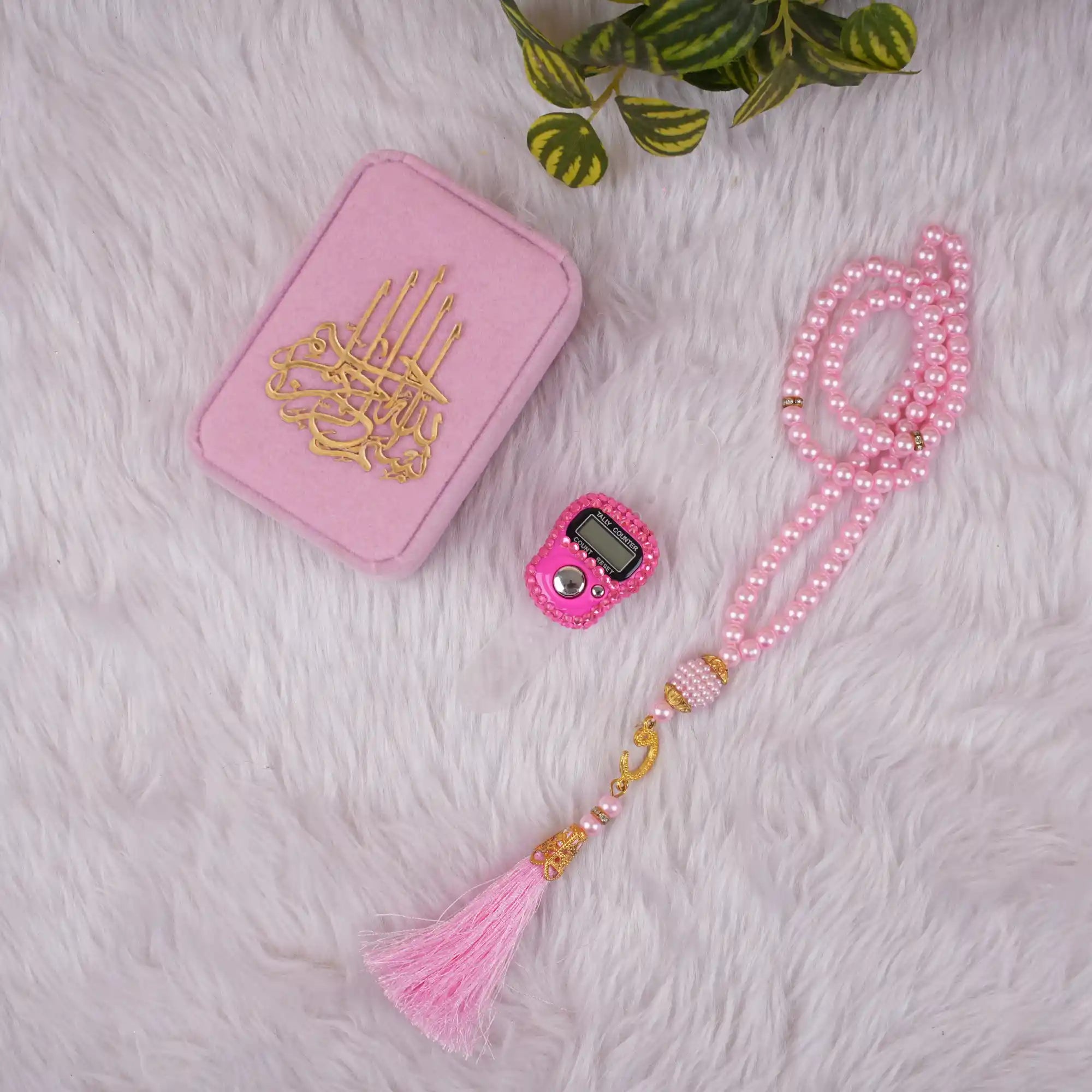 Pink Velvet Tasbeeh Combo laid out with pearl prayer beads, digital tally counter, and elegant velvet box, suitable for Eid and Ramadan gifts.