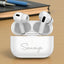 Pro Pods Wireless Earbuds in open charging case with personalized 'Saumya' engraving, showcasing sleek in-ear design and touch control sensors.