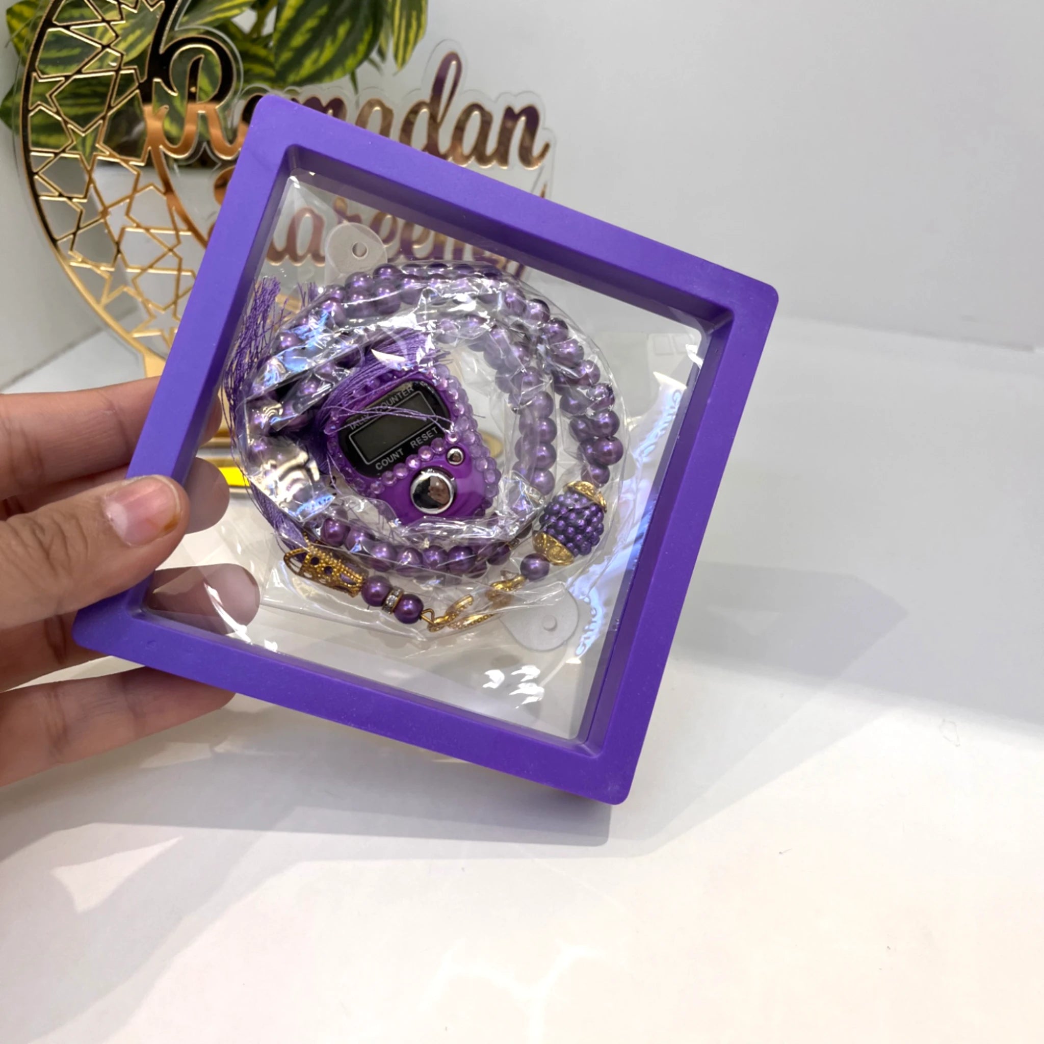 Purple Transparent Tasbeeh Combo - Islamic Gift featuring a 100-bead pearl tasbeeh and digital counter in a purple display frame. Ideal for Ramadan or Eid gifting.