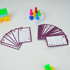 Colorful game pieces and cards on a light surface