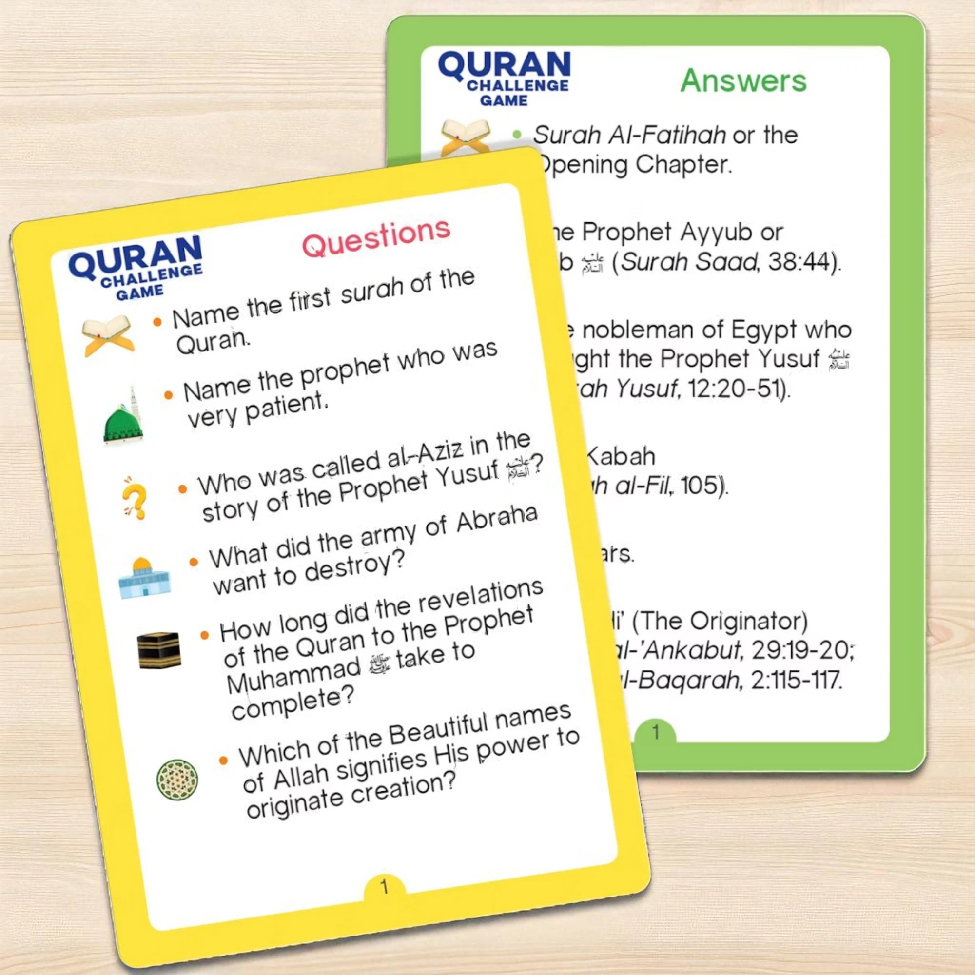 Two cards from a Quran Challenge Game on a wooden surface