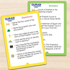 Two cards from a Quran Challenge Game on a wooden surface