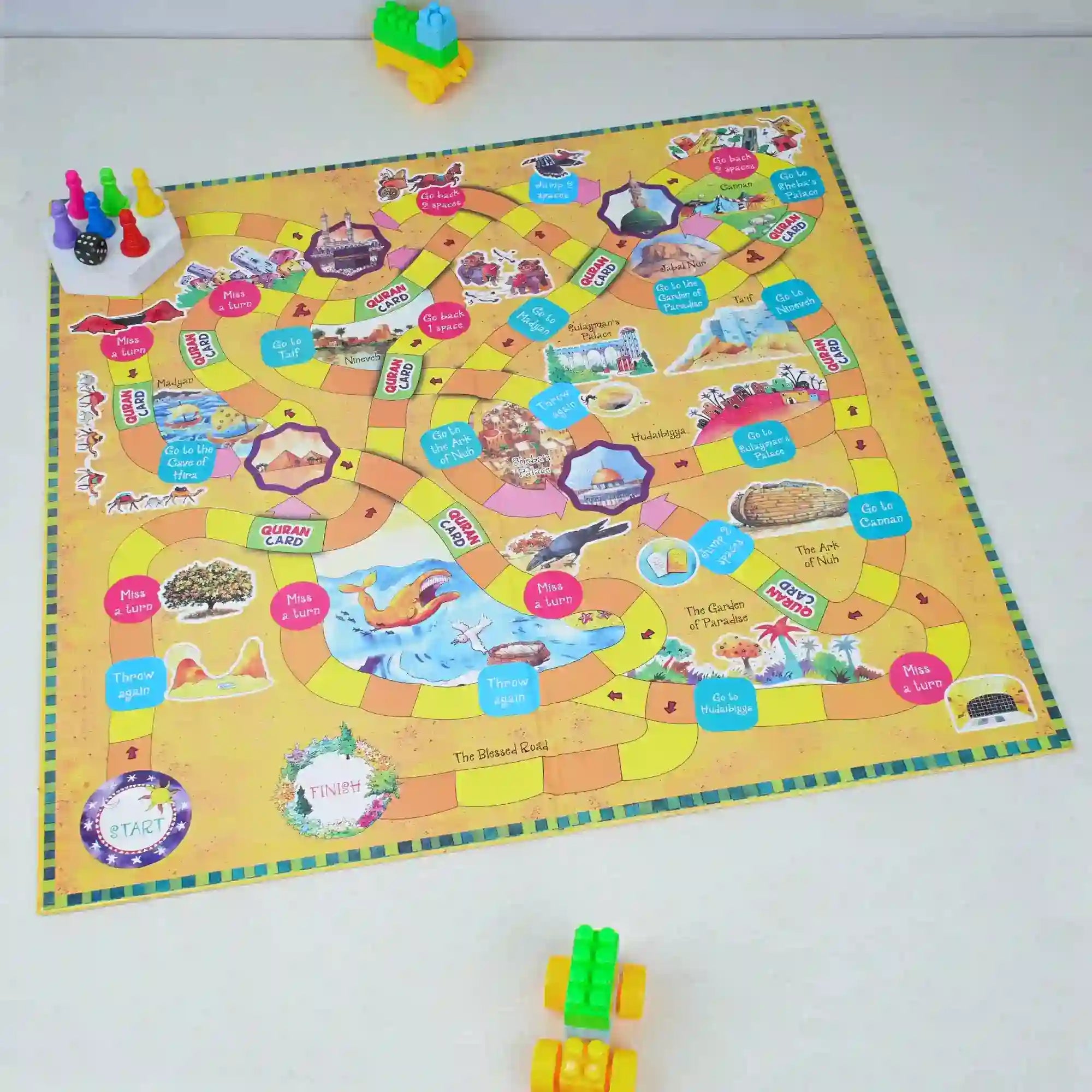 Colorful children's board game on a white surface