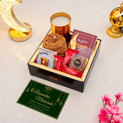 Rahmat Hamper - Spiritual Gift Set featuring prayer essentials, gourmet treats, and a scented candle in a luxury black box for Ramadan gifting.