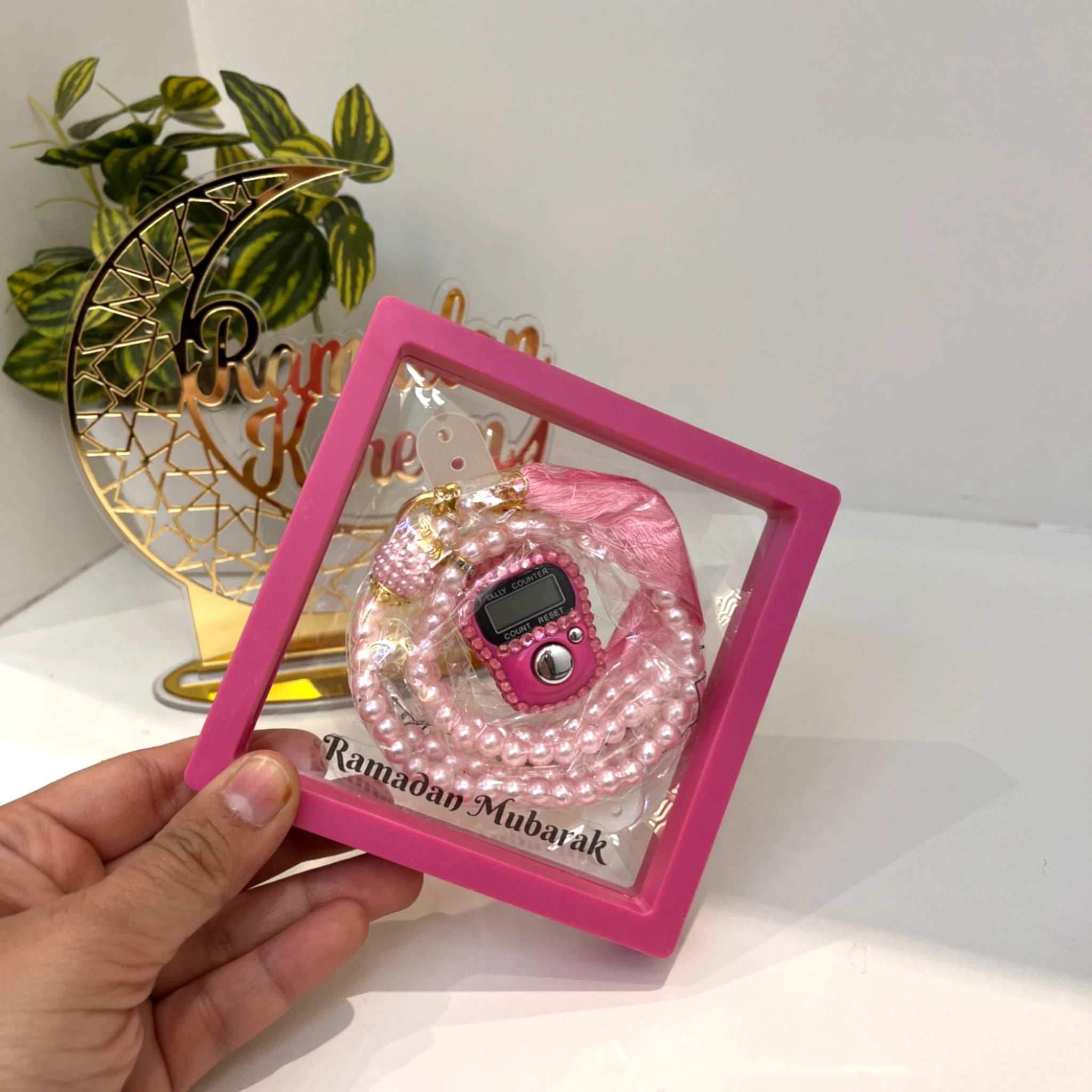 Pink Ramadan Mubarak Tasbeeh Combo with digital counter and pearl beads in gift box. Ideal spiritual gift for Ramadan devotion.