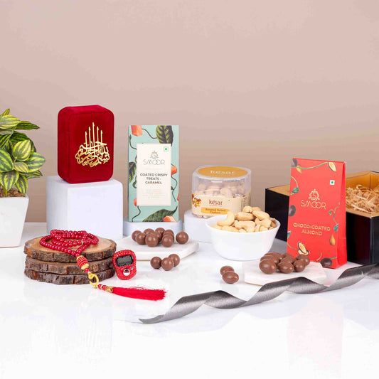 Red Velvet Blessings Hamper with Tasbeeh, choco-almonds, caramel treats, and cashews, ideal for Ramadan and Eid gifting.