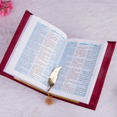 Open Velvet Quran Translation in red with bilingual Arabic-English text and gold feather bookmark, perfect for religious gifting.