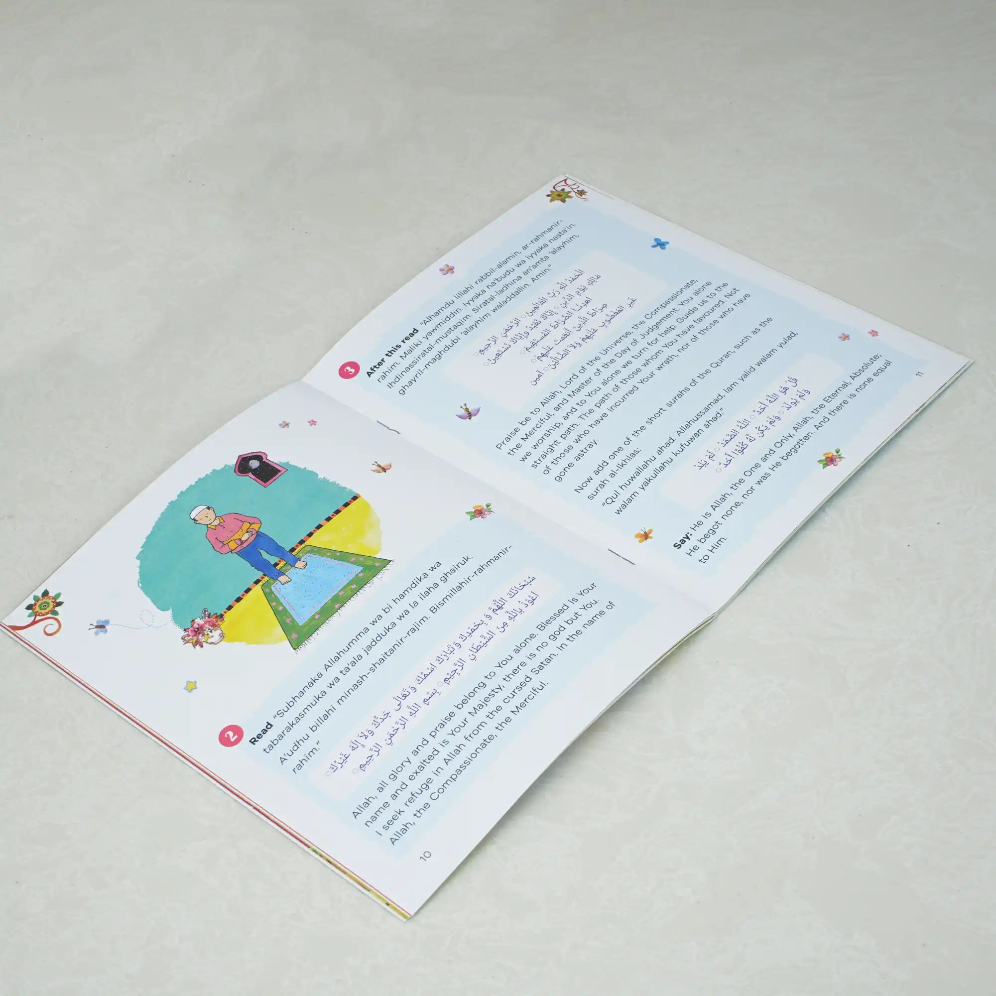 Children's book open to a page with illustrations and text on a light gray background