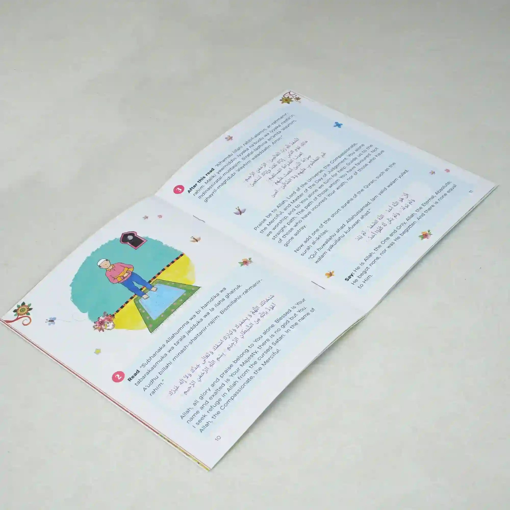 Children's book open to a page with illustrations and text on a light gray background