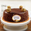 Chocolate cake with Ferrero Rocher chocolates on top, featuring the Ferrero Rocher logo.