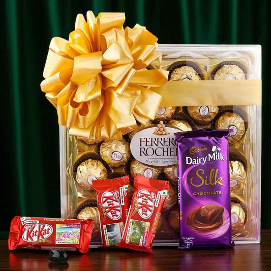 Show Your Love Combo gift hamper featuring 24-piece Ferrero Rocher box, Cadbury Silk, KitKat bars, and a golden ribbon – perfect for gifting loved ones."