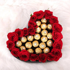 Sweetheart Symphony - Roses & Rochers Set featuring 20 red roses and 20 Ferrero Rochers arranged on a heart-shaped base. Ideal for romantic gifting.