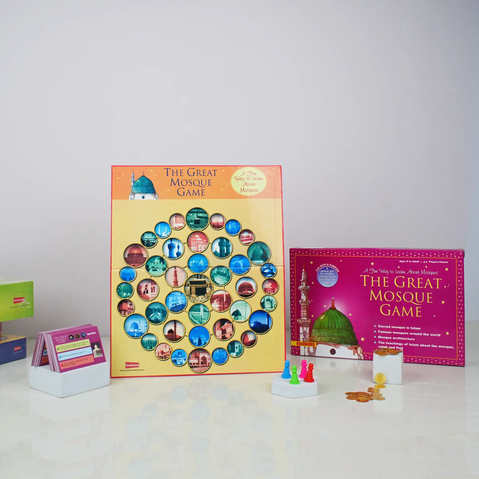 Board game set with colorful tiles and game pieces on a white surface.