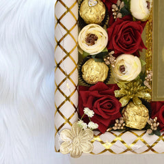 Mahr-e-Barakah Tray Gift Set with red and white artificial roses, Ferrero Rocher chocolates, and golden floral accents on a decorative tray corner.