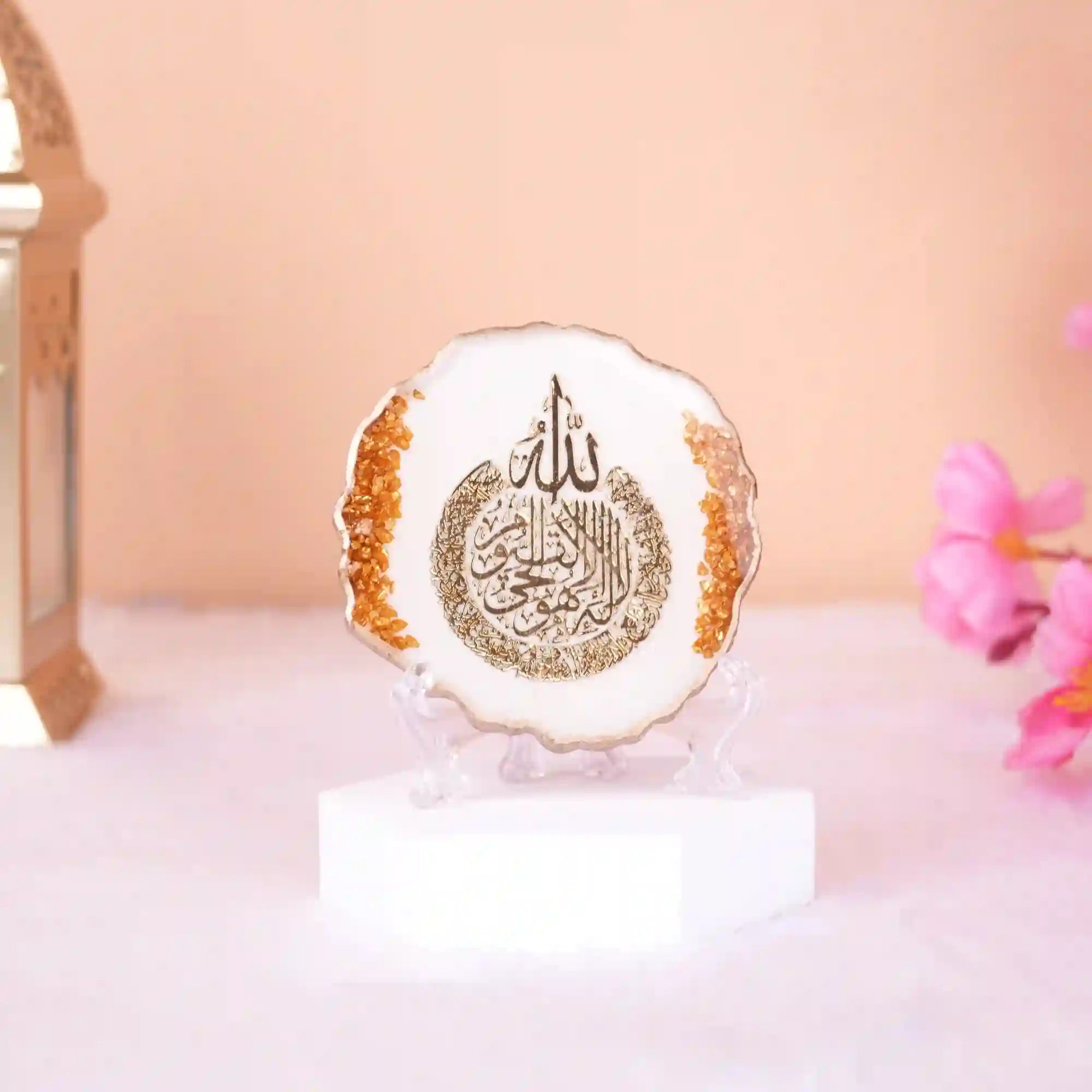 3" Ayatul Kursi Frame in white with golden flakes, ideal for Ramadan & EID home decor or Islamic gift. Displayed on a clear stand with floral accents.