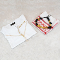 White garment with embroidery and a folded towel with a decorative pattern on a light surface