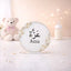 Kids Floral Pearl Name Frame with Stand featuring the name 'Azza' in Arabic and English, adorned with white roses and pearls, ideal for nursery decor.