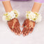 Handcrafted Floral Gajra - Wedding Accessory worn on wrists with intricate mehndi, featuring white roses and jasmine buds for traditional ceremonies.