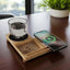 Willow 3.0 Wireless Charger with Cup Warmer & Phone Stand charging a smartphone while keeping a glass cup warm, ideal for modern desk setups.