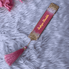 Personalized pink and gold resin bookmark with name 'Sufiya Shaikh' and pink tassel, designed for gifting and Islamic book accessories.
