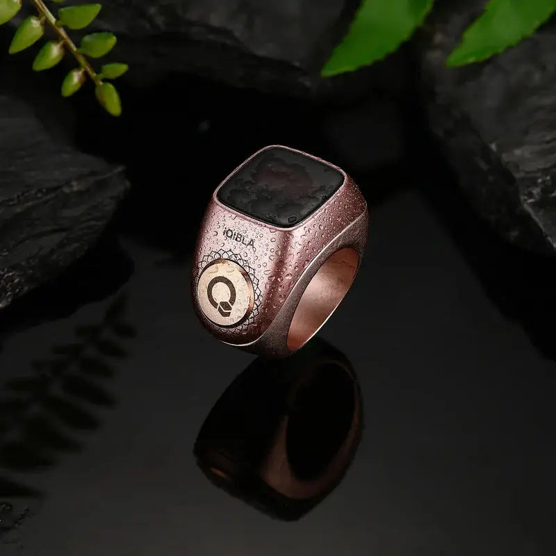 Rose gold Zikr Ring Flex Pro with water droplets, stylish and functional for prayer tracking and tasbih counting.