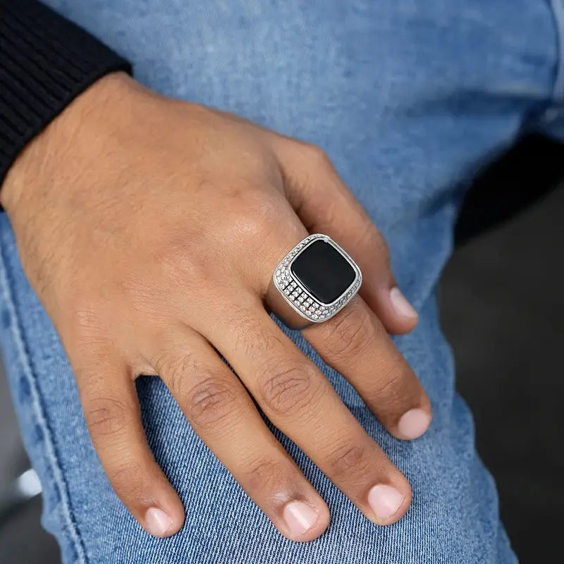 Silver Zikr Ring with 99 Swarovski Zirconia worn on hand, paired with casual jeans. Modern Islamic accessory for men and daily prayer.