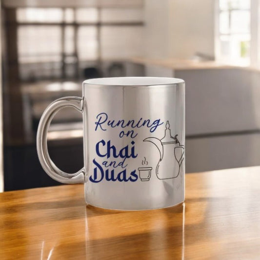 Personalized metallic mug in silver with 'Running on Chai and Duas' text and teapot illustration, ideal faith-inspired gift for home or office use.
