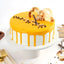 Indulgent Butterscotch Cake - Premium with creamy caramel glaze, chocolate chips, and decorative toppings on a white cake stand.