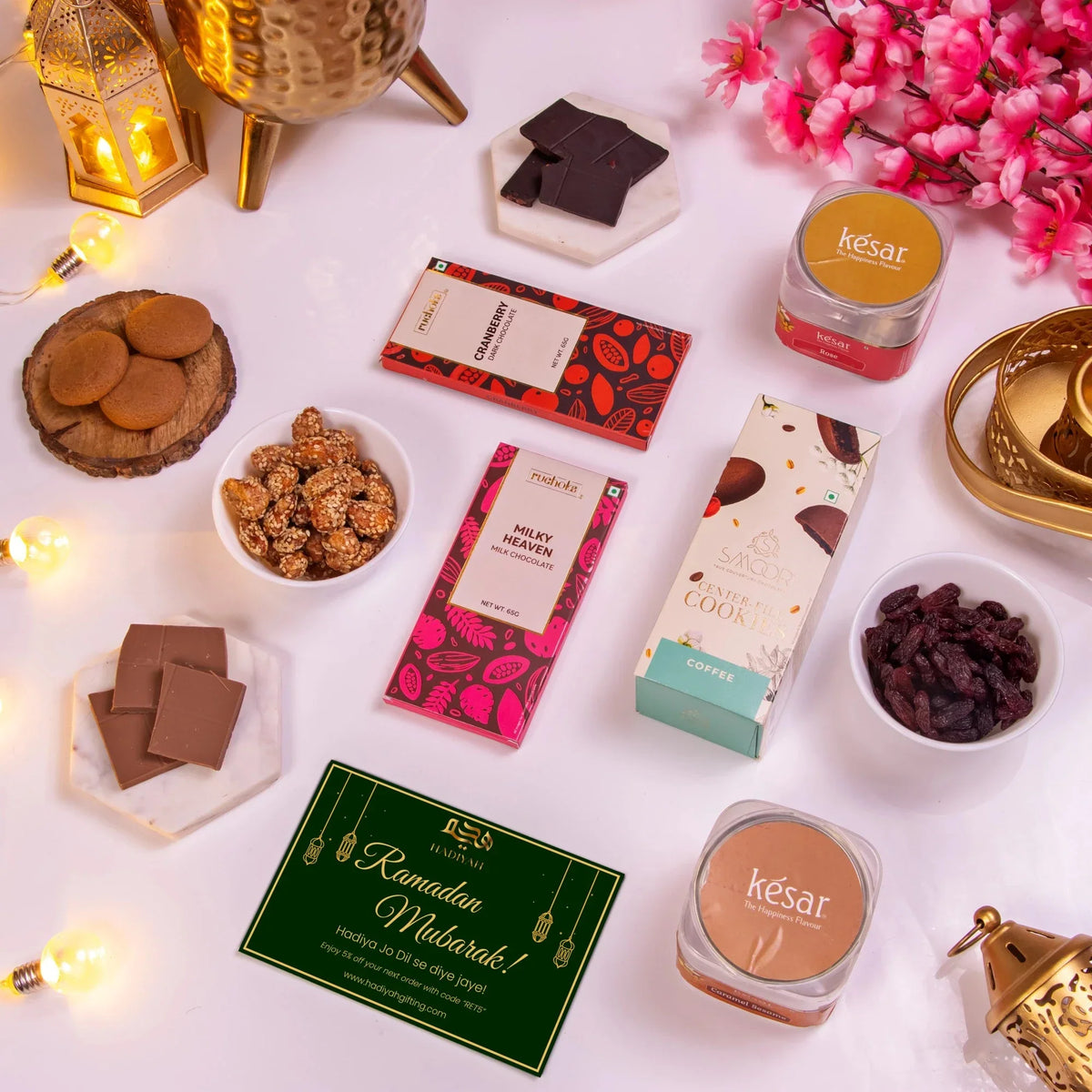 Elegant Ramadan gift box for teachers with chocolates, cookies, and candles.