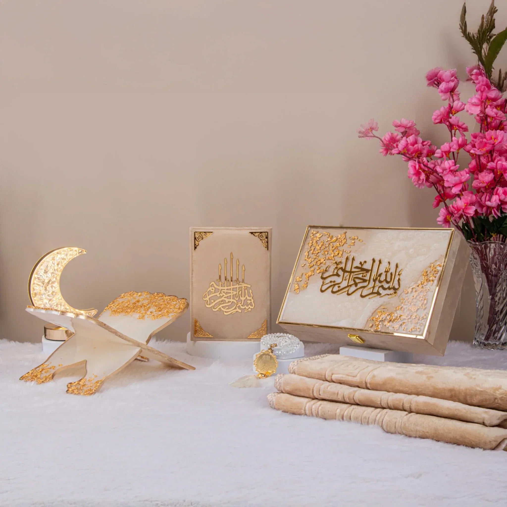 Elegant Ramadan gift set with Quran, prayer rug, and golden decor