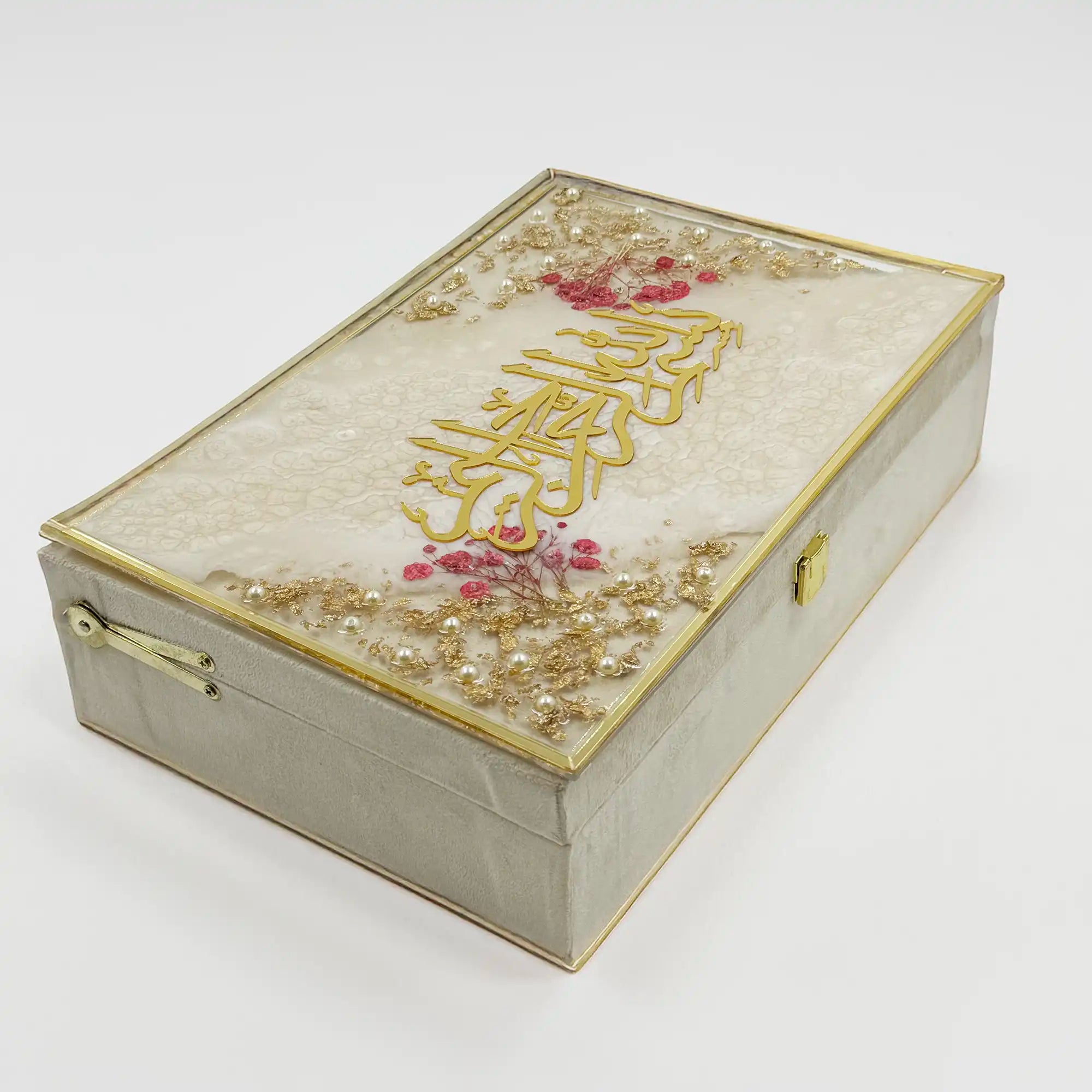 Luxurious designer gift box with gold accents and floral embellishments