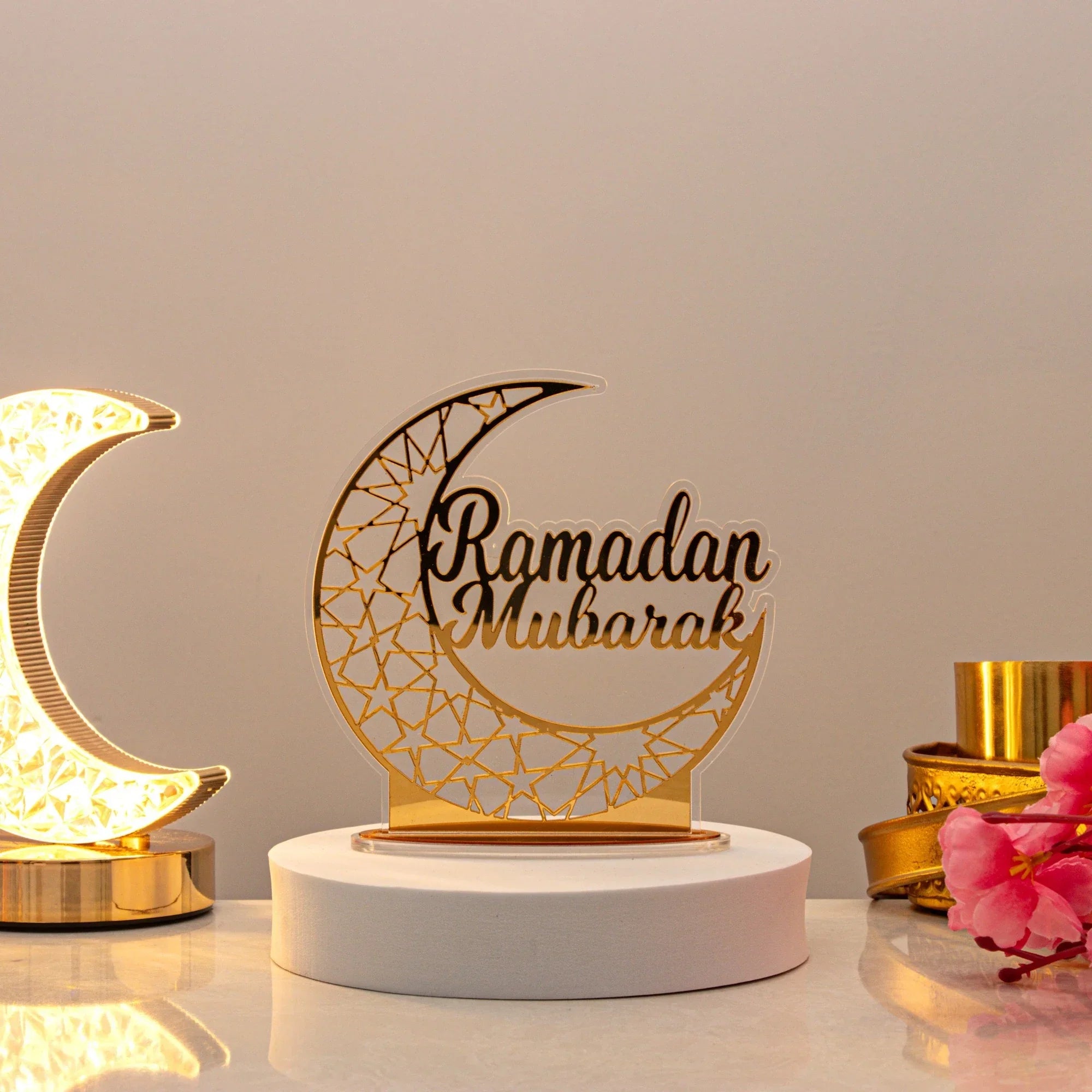 Elegant Ramadan Mubarak crescent moon decor with golden accents