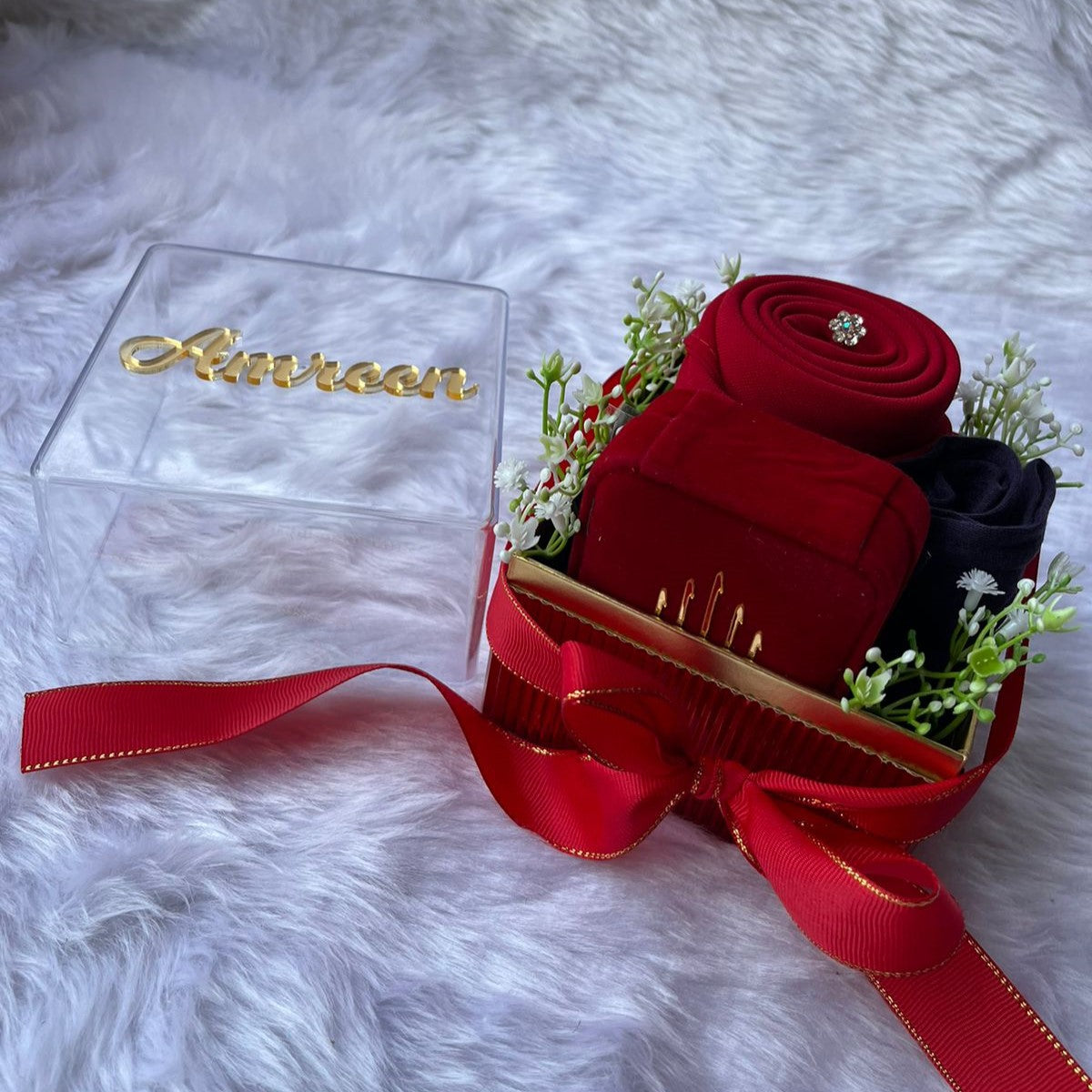 Elegant Ramadan gift box for women with hijabs and floral decor.