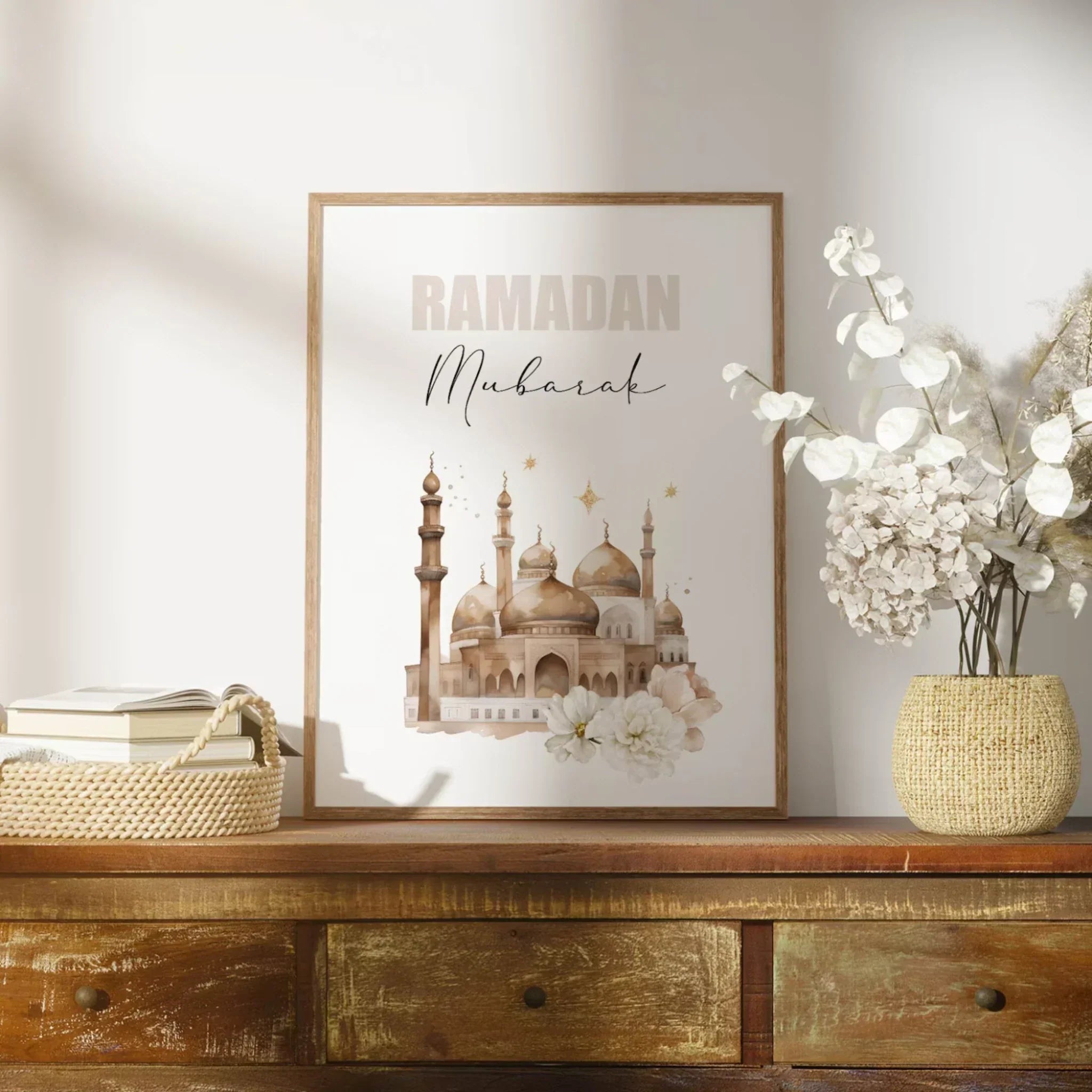 Elegant Ramadan Mubarak picture frame with mosque art on wooden table