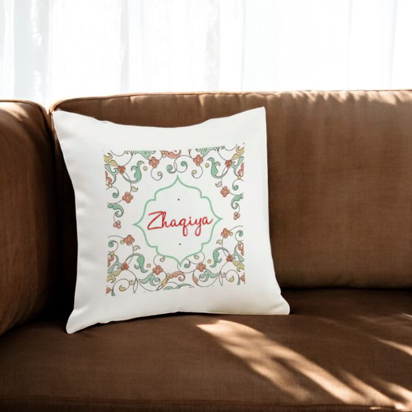 Personalized backrest pillow with floral design and nameZhaqiya" on a brown sofa.