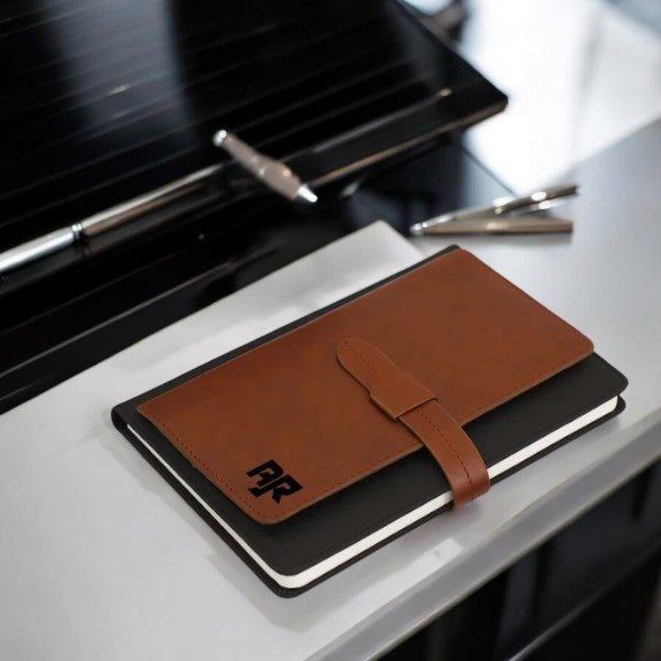 Elegant leather-bound dua book with stylish strap on modern desk