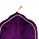 Close-up of Purple Dome Janamaz top with gold tassel and intricate velvet pattern, showcasing premium craftsmanship.