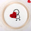 Heartfelt Vanilla Cake with cute stick figure holding red heart, perfect for anniversaries and love-filled celebrations. Soft, fluffy vanilla flavor.