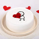 Vanilla Heart Cake featuring adorable character hugging red heart, ideal for romantic occasions. Smooth white frosting and round shape design.