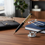 Decorative pen with black and gold design on a white background
