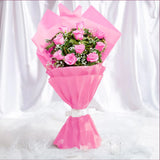 10 Pink Roses Bouquet arranged in packaging, close-up